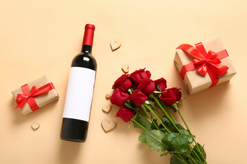 Obraz na płótnie Canvas Bottle of wine, rose flowers, gifts and heart-shaped cookies on beige background. Valentine's Day celebration