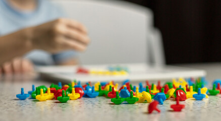 Fototapeta premium Educational colorful puzzles close-up on the background of children's hands