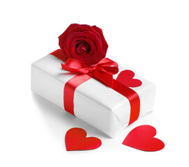 Gift box with beautiful bow, hearts and rose flower isolated on white background. Valentine's Day...