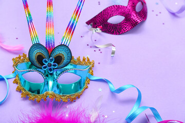 Carnival masks with confetti on lilac background