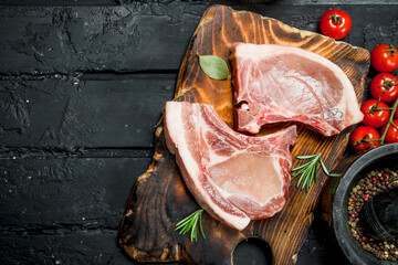 Raw pork steak on the bone with spices.