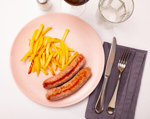 Eastern european cuisine - sausages with potatoes and onion