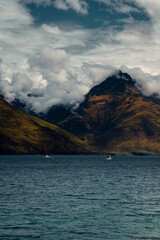 Vertical Shot of Boats on Lake with Mountains In Distance in New Zealand Nature Landscape 