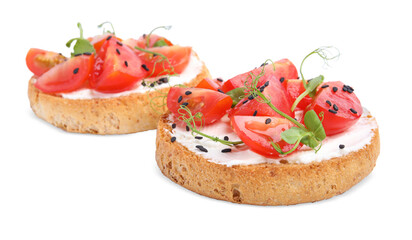 Tasty rusks with cream cheese, fresh tomatoes and black sesame seeds isolated on white