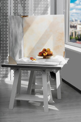 Stand with juicy peaches and double-sided backdrops in photo studio