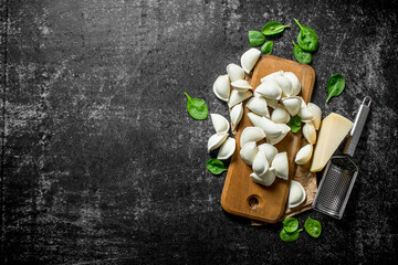 Raw dumpling with spinach and Parmesan.