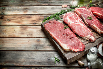 Raw meat. Beef steaks and pork with spices.