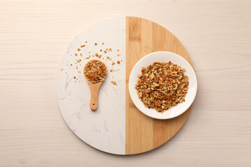 Tray with dried orange zest seasoning on wooden table, top view