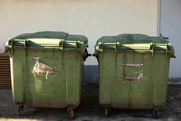 Green garbage cans. Containers for waste on street.