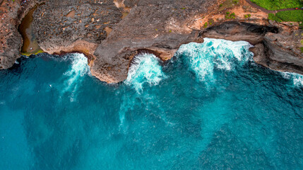Aerial Capture of Turquoise Water and Steep Cliffs in Bali, Indonesia