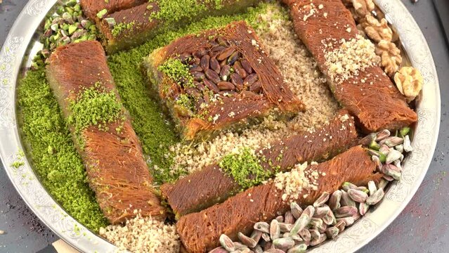 Traditional turkish baklava pistachio pastry. Dilberdudagi, ozel kesim baklava, cikolatali baklava, fistikli baklava, katmer, fistikli kadayif, kattafi, fistik sarma, soguk baklava, midye baklava, cev