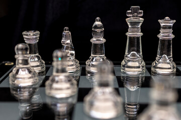 Transparent king chess piece, queen bishop knight rook and pawn chess pieces with black background