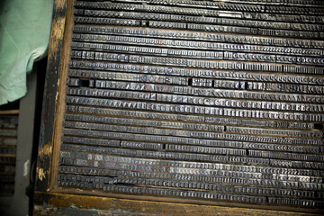 A vintage printing press in Lisbon, Portugal has tiny typeface.