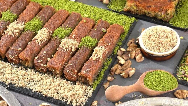 Traditional turkish baklava pistachio pastry. Dilberdudagi, ozel kesim baklava, cikolatali baklava, fistikli baklava, katmer, fistikli kadayif, kattafi, fistik sarma, soguk baklava, midye baklava, cev