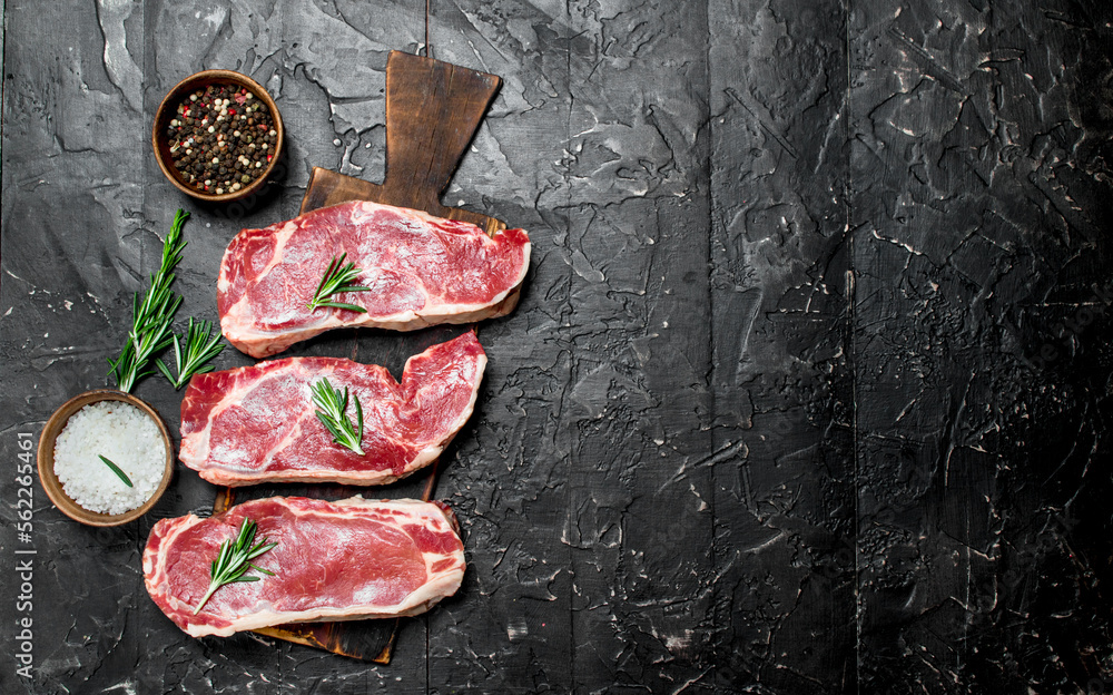 Canvas Prints Raw marbled beef steaks with salt and spices.