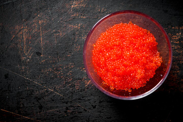 Red caviar in a glass bowl.