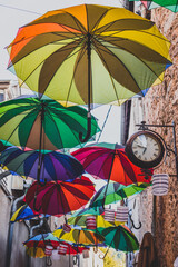 Fototapeta na wymiar Colorful umbrellas on the street 