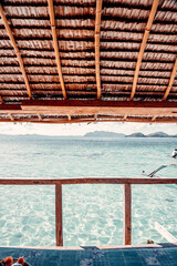 Horizontal View From Inside of Beach Bungalow, Lookout Out At Crystal Clear Water