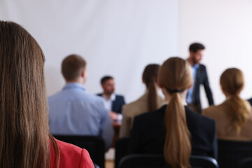 People having business training in conference room, selective focus