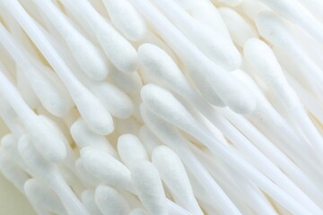 Many cotton buds as background, closeup view