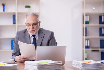 Old male employee and too much work in the office