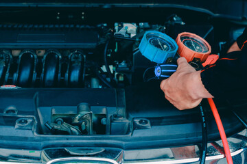 car service worker repairing vehicle , For customers who use cars for repair services .