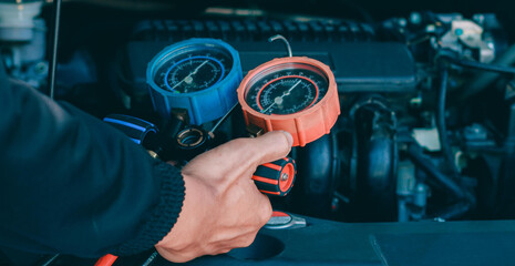 car service worker repairing vehicle , For customers who use cars for repair services .