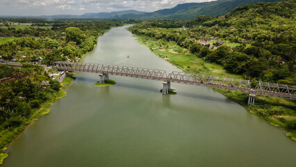 Aerial view of the Opak river and the Kretek bridge during the day in Bantul, Indonesia