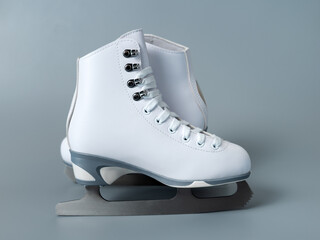 Ice skates shoes on gray background