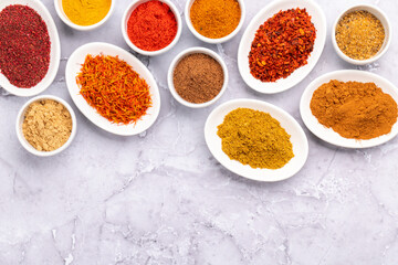 Various dried spices in small bowls