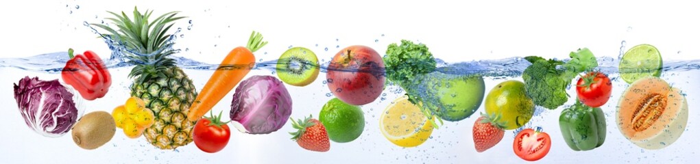 Fresh fruits and vegetable floating in water splash on white background.