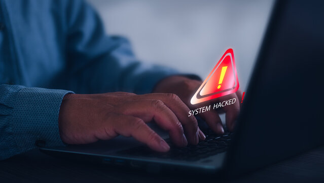 Businessman using computer laptop, System warning hacked alertsign for notification error personal data hacking  virus  cybercrime.concept Cybersecurity vulnerability computer network.