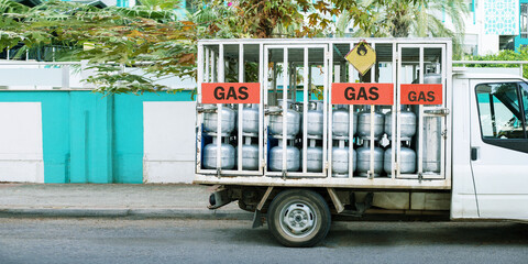  Truck delivered propane cylinders. Panoramic banner with copy space.