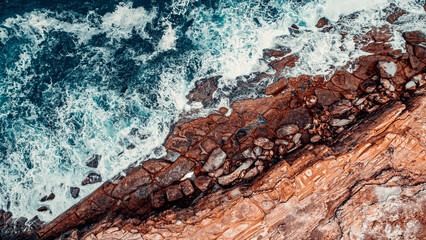 Drone view at Putty Beach, Australia, Blue Water and Sandstone Swirls