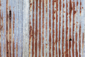 Old zinc surface background or the tin roof background with the rust