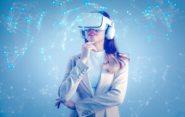 Asian businesswoman with VR headset looking at virtual reality screen. Business, technology, internet iot and networking concept.	