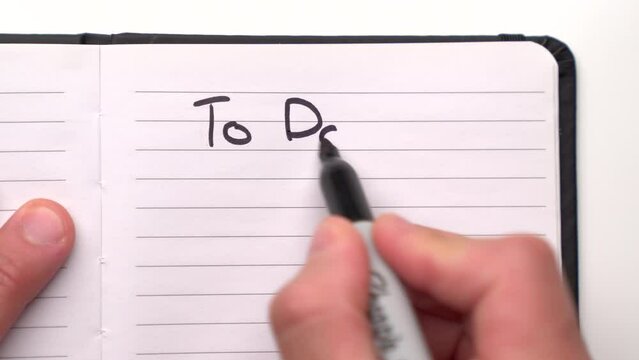 Writing A "To Do" List In A Notebook 4K