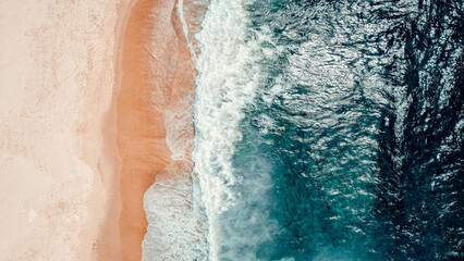 Aerial Drone Overhead Shot of Beach With No People, Blue Water, Waves, Sunny Day © ANITEK MEDIA 