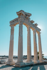 The ruins of the ancient temple of Apollo in the city of Side, Antalya province, Turkey against the blue sky.