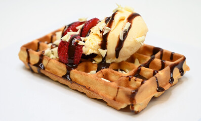 waffles topped with ice cream and chocolate ganache