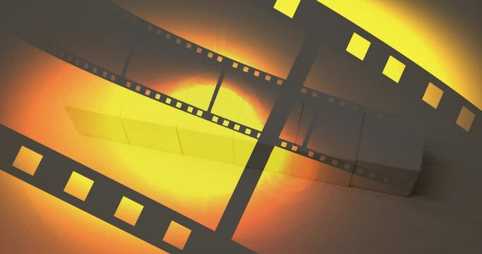 Animation of film tape and countdown on yellow background
