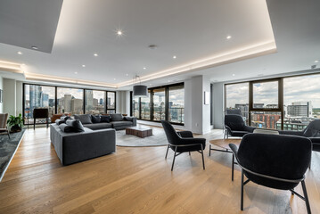 Luxury modern apartment in condominium in Montreal perfectly staged and furnished with amentinites common areas swimming pool, rooftop, terrace, gym, garden and city views - obrazy, fototapety, plakaty