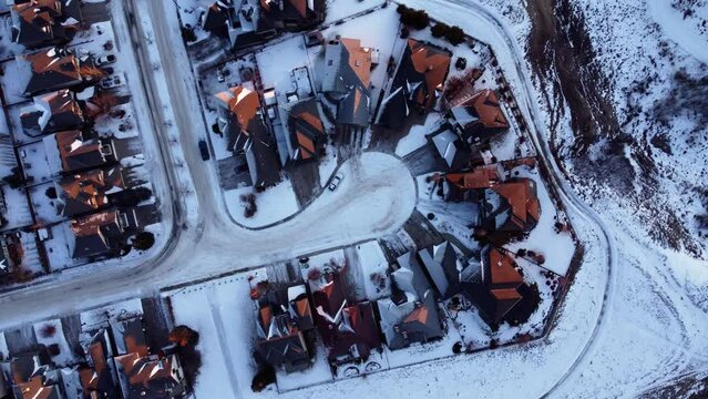 Drone footage of Calgary's houses during a beautiful winter sunrise