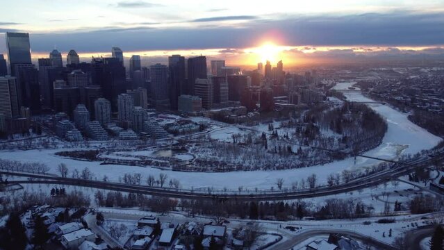 A flying drone's perspective of a winter sunset in Calgary's downtown