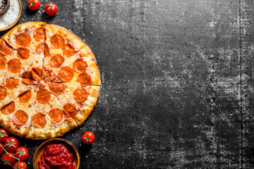 Pepperoni pizza with tomatoes, spices and tomato paste.