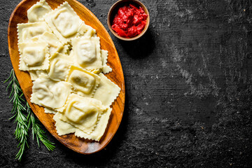 Ravioli with tomato paste and rosemary.