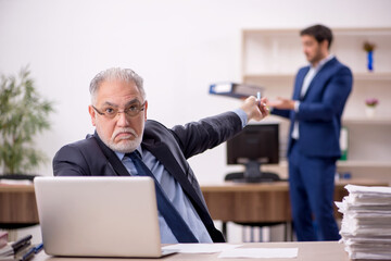 Two male colleagues working in the office
