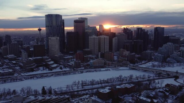 A winter sunset captured from a drone's point of view flying over Calgary downtown