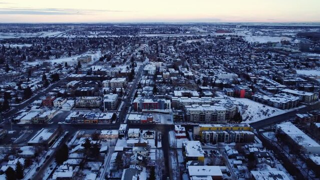 A winter sunset viewed from above with a flying drone in Calgary's downtown
