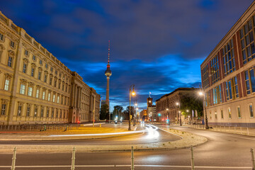 The beautiful rebuilt City Palace and the famous TV Tower in Berlin at dawn